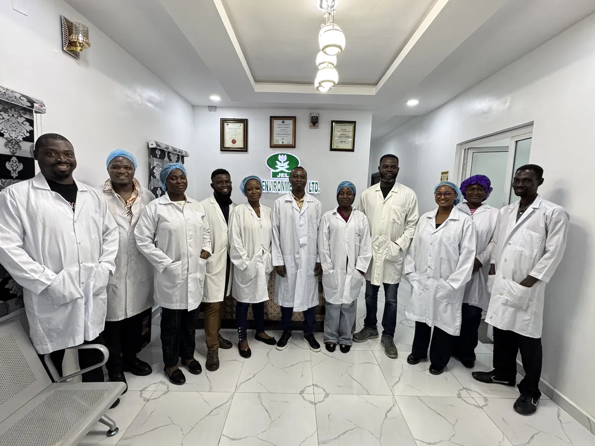 Jacio Environmental team members in lab coats at the company headquarters